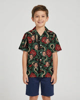 Serpent & Dagger Goth Hawaiian Shirt with printed faces, worn by a child