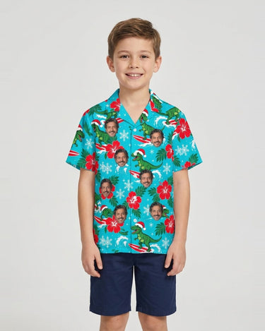 Surfing T-Rex Santa Dinosaur Christmas Hawaiian Shirt with printed faces, worn by a child