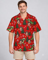 T-Rex Santa Dinosaur Christmas Hawaiian Shirt with printed faces, worn by a man