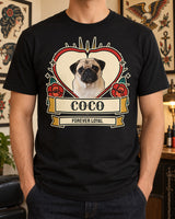 Black custom pet tattoo shirt worn with dark jeans, showing a pug inside a red heart with roses, teal leaves, gold rays and a cream Coco name scroll.