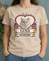 Natural pet tattoo photo tee worn with denim trousers, featuring a white cat inside a pink heart with pink roses, blue leaves and the name Luna.