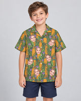 Tiki Surf Legend Hawaiian shirt with printed faces, worn by a child