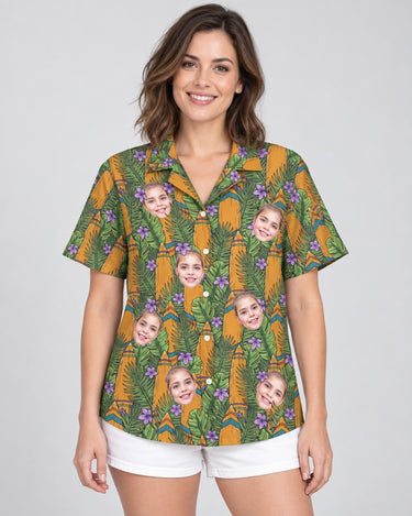 Tiki Surf Legend Hawaiian shirt with printed faces, worn by a woman