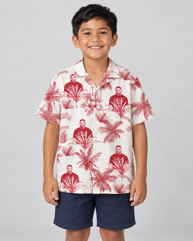 Toile de Jouy Palm Hawaiian shirt with printed faces, worn by a child
