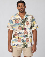 Tranquil Island Hawaiian shirt with printed faces, worn by a man