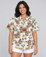Tropical Escape Hawaiian shirt with printed faces, worn by a woman