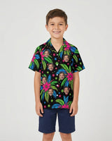 Tropical Fireworks Christmas Hawaiian Shirt with printed faces, worn by a child