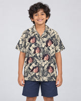 Tropical Garden Elegance Hawaiian shirt with printed faces, worn by a child