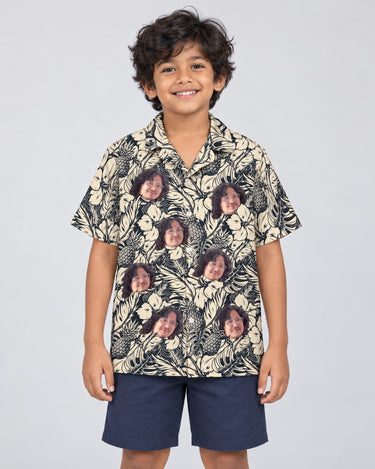 Tropical Garden Elegance Hawaiian shirt with printed faces, worn by a child