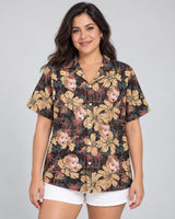 Tropical Grunge Bloom Hawaiian shirt with printed faces, worn by a woman