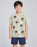 Tropical Leaf Dreams Hawaiian shirt with printed faces, worn by a child