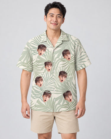Tropical Leaf Dreams Hawaiian shirt with printed faces, worn by a man