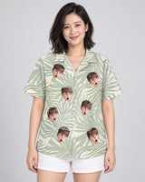 Tropical Leaf Dreams Hawaiian shirt with printed faces, worn by a woman