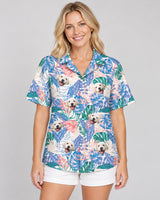 Tropical Leaf Fusion Hawaiian shirt with printed faces, worn by a woman