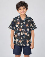 Tropical Night Bloom Hawaiian shirt with printed faces, worn by a child