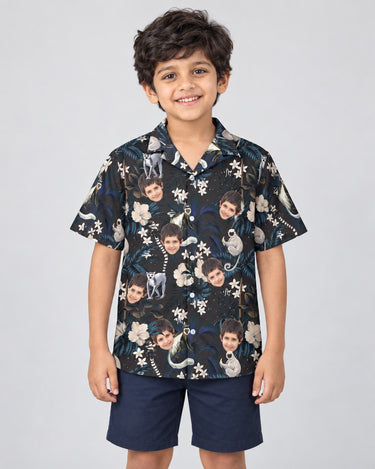Tropical Night Bloom Hawaiian shirt with printed faces, worn by a child