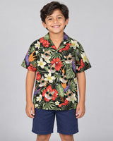 Tropical Oasis Hawaiian shirt with printed faces, worn by a child