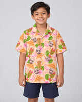 Tropical Tiki Grill Fest Hawaiian shirt with printed faces, worn by a child