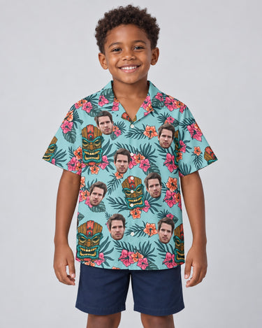 Tropical Tiki Mask Hawaiian shirt with printed faces, worn by a child