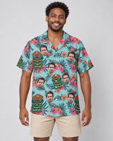 Tropical Tiki Mask Hawaiian shirt with printed faces, worn by a man