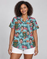 Tropical Tiki Mask Hawaiian shirt with printed faces, worn by a woman