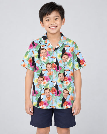 Tropical Toucan Hawaiian shirt with printed faces, worn by a child