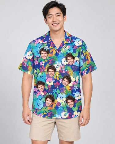 Vibrant Hibiscus Hawaiian shirt with printed faces, worn by a man