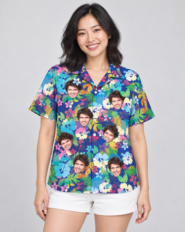 Vibrant Hibiscus Hawaiian shirt with printed faces, worn by a woman