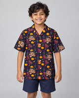 Vintage Black Cat Halloween Hawaiian shirt with printed faces, worn by a child
