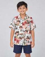 Vintage Island Palm Hibiscus Hawaiian shirt with printed faces, worn by a child