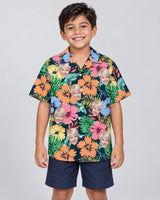 Vivid Summer Hawaiian shirt with printed faces, worn by a child