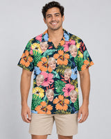 Vivid Summer Hawaiian shirt with printed faces, worn by a man