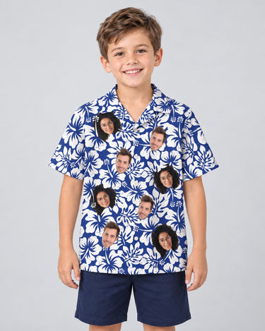 Weathered Tropic Hibiscus Hawaiian shirt with printed faces, worn by a child
