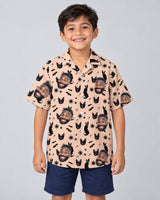 Witchy Black Cat Halloween Hawaiian shirt with printed faces, worn by a child