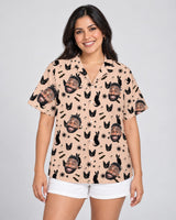 Witchy Black Cat Halloween Hawaiian shirt with printed faces, worn by a woman