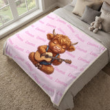 Highland cow name blanket in cotton pink spread over a bed