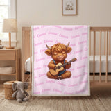 Pink Highland cow name blanket hanging on a wooden crib in a nursery