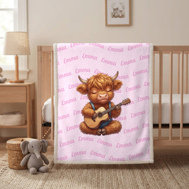Pink Highland cow name blanket hanging on a wooden crib in a nursery