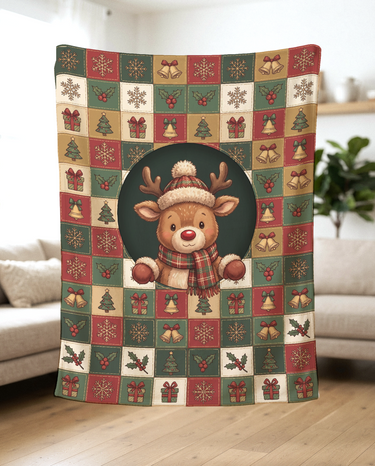 Cozy Reindeer Holiday Squares fleece blanket held up in a bright living room to show the full Christmas artwork and soft drape