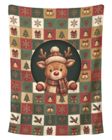 Cozy Reindeer Holiday Squares Christmas blanket printed edge to edge with a smiling reindeer in a plaid scarf, bobble hat and mittens peeking out of a dark green circle, surrounded by printed patchwork squares of snowflakes, bells, holly, trees and gifts, shown flat on a pure white background