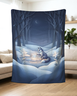 Frost Flower Snow Fox fleece blanket held up in a bright living room to show the full winter artwork and soft drape