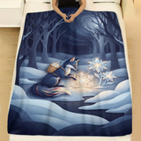 Moonlit Snow Fox Crystal Flower holiday throw blanket spread across a made bed with white linen, showing a navy snow fox with a woven basket planting a glowing snowflake beside crystal flowers under a crescent moon