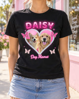 Woman wearing a black Y2K pet photo t-shirt with a golden retriever and a corgi in a pink rhinestone heart and the name Daisy
